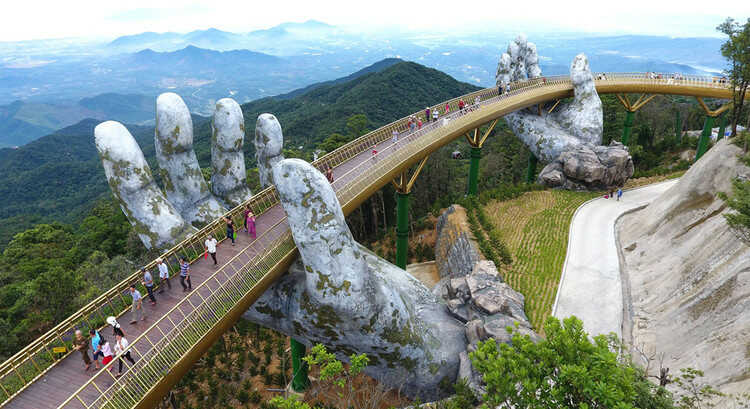 You should take a picture at the famous destination in Ba Na Hills - Golden Bridge