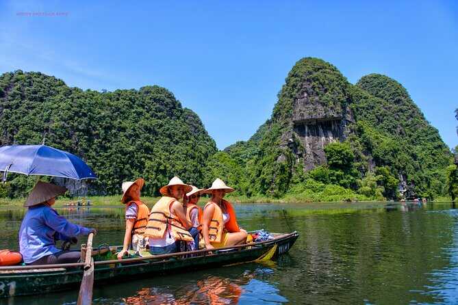 Tourists canoeing and sightseeing in the cave.