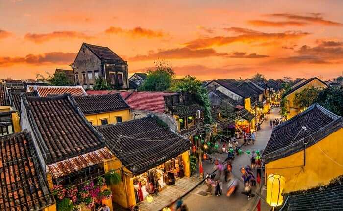 Hoi An Ancient Town by night are lit up by colorful lanterns create a beautiful atmosphere for travelers.