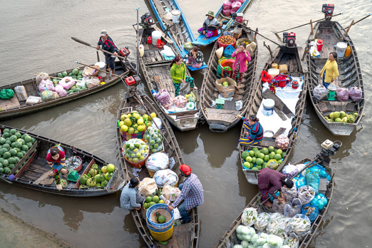 Tourists enjoy visiting the largest floating market in the West