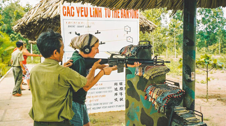 Tourists trying military sports shooting