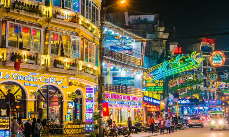 The night market comes alive with vibrant energy, offering travelers an unforgettable Sapa travel experience.