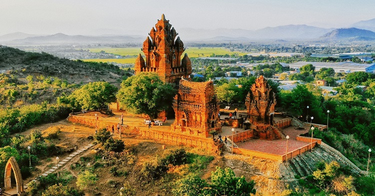 Red brick forms the base of Po Klong Garai's towers, each tier showcasing a unique tapestry of intricate carvings.