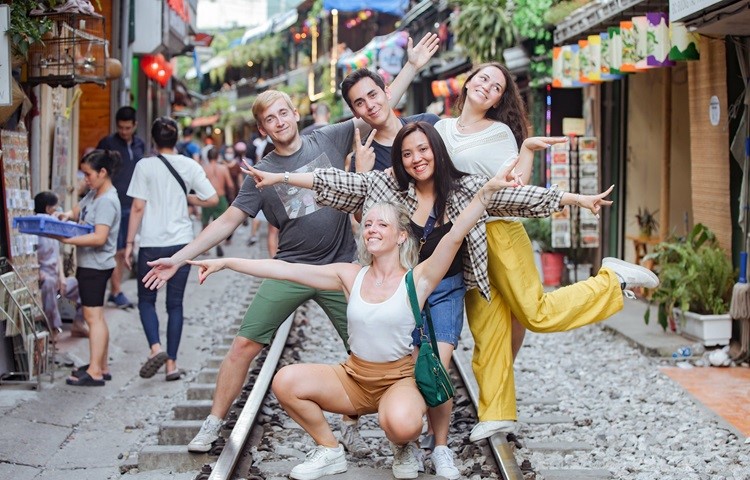 Visitors enjoying check-in at Hanoi Train Streets.