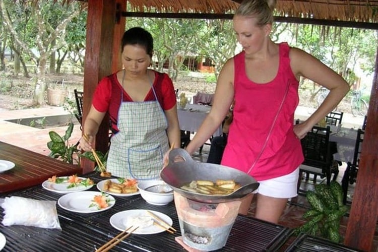 Visitors enjoying cooking classes during their trip to Southern Vietnam